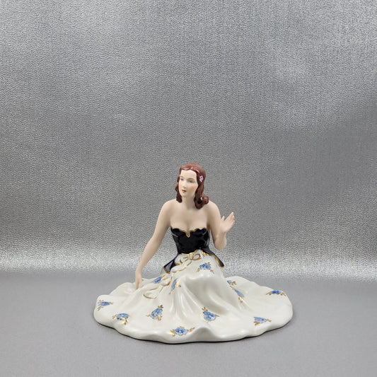 Porcelain figurine "Lady sitting" by Royal Dux Bohemia.