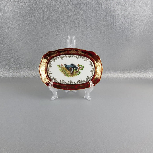 The porcelain small serving tray, "Hunting" (Blackcock bird) in red by Queens Crown. Size 21x 14 cm.