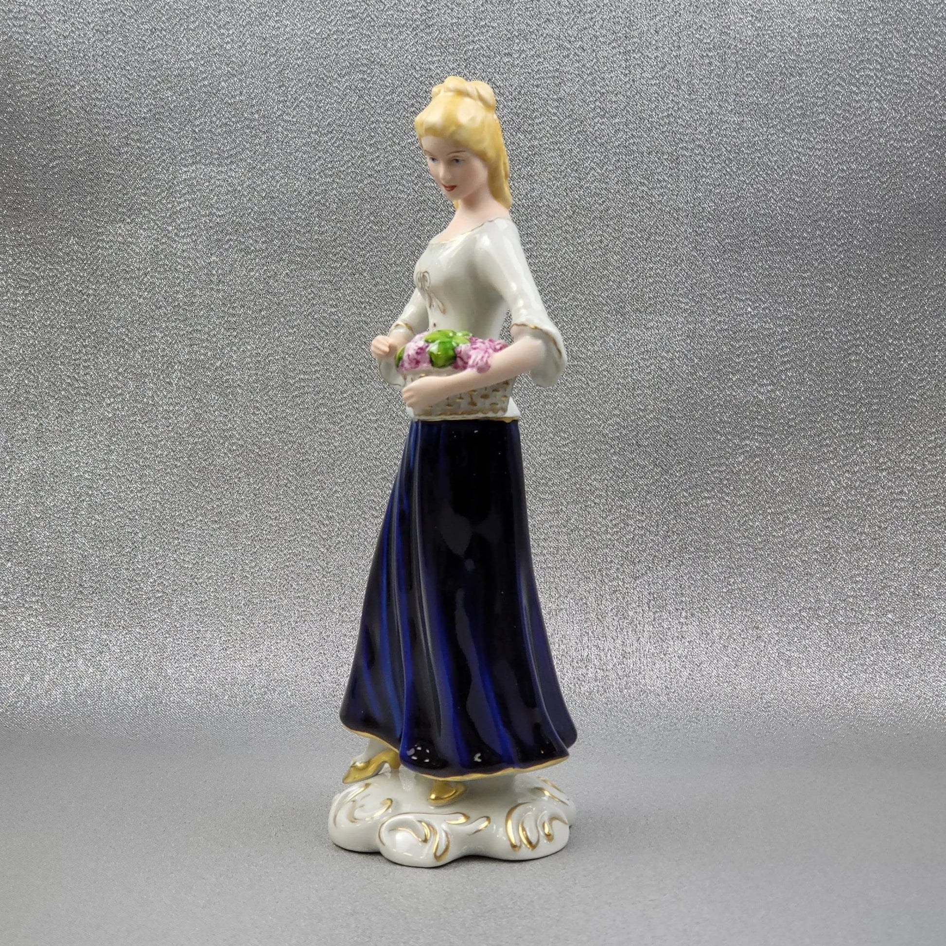 Porcelain figurine "Winemaker" by Royal Dux Bohemia.