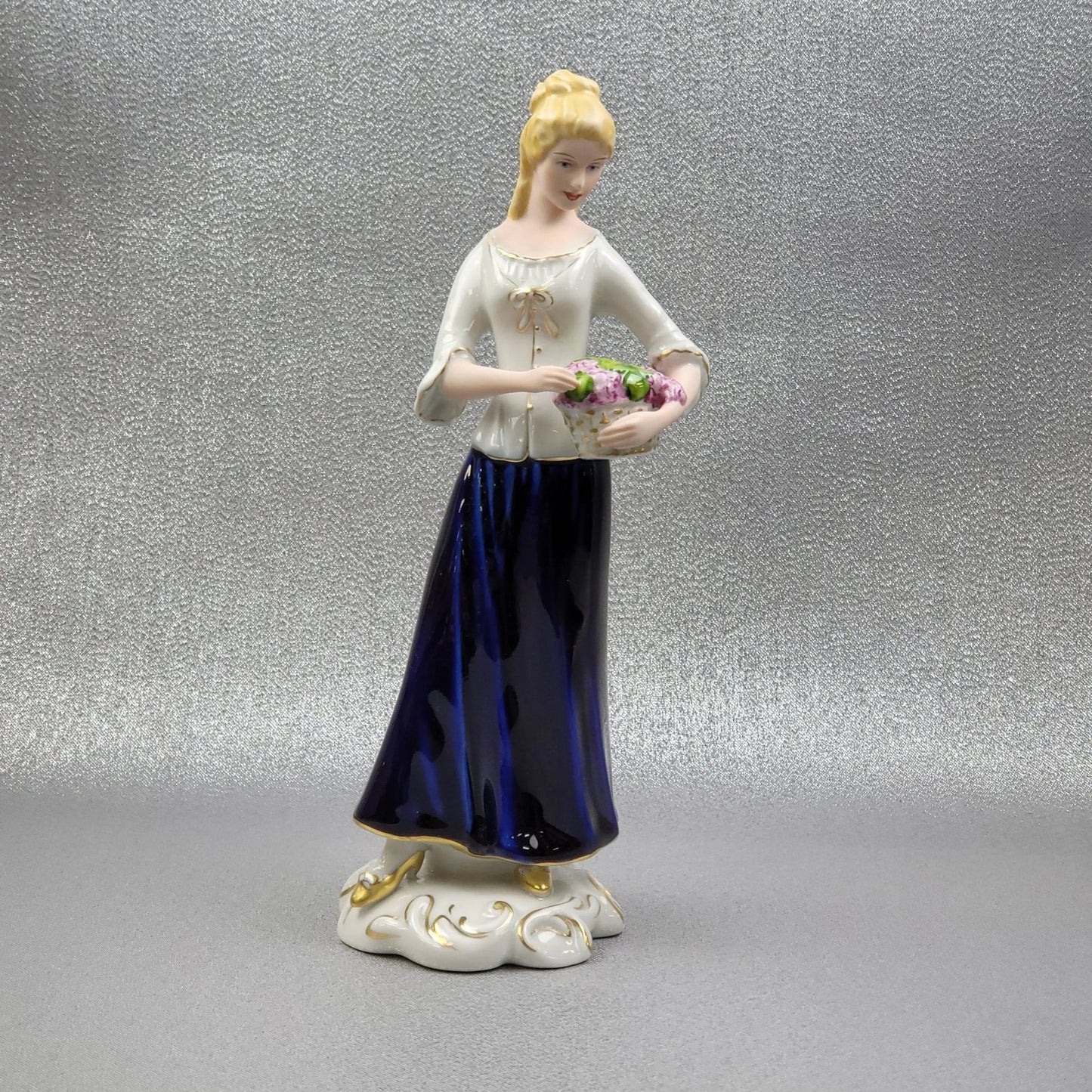 Porcelain figurine "Winemaker" by Royal Dux Bohemia.