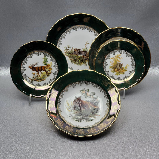 The porcelain deep plate, "Hunting" in green by Queens Crown. Diameter 23 cm.